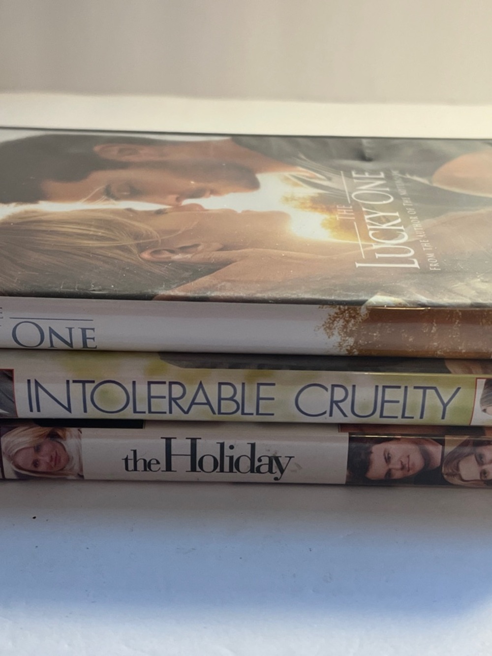 Three Romance DVD’s- Intolerable Cruelty, The Holiday, Lucky One